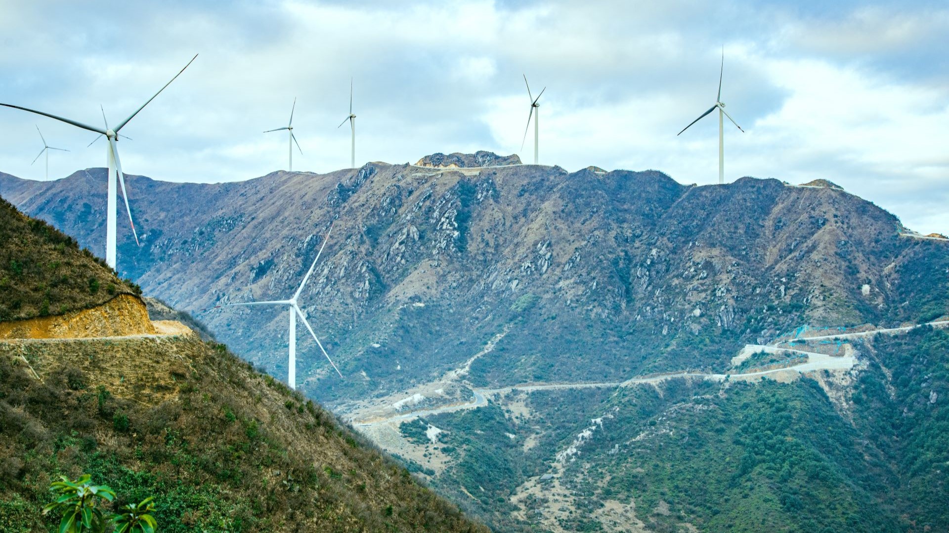 Wind turbines on mountainous landscape