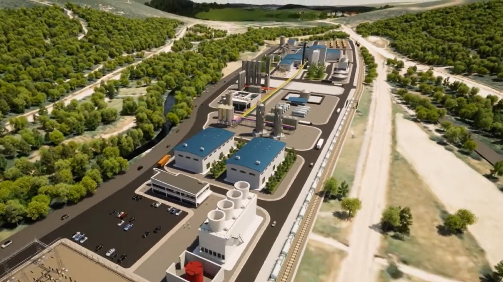 Computer generated aerial view over industrial buildings and roads with trees surrounding