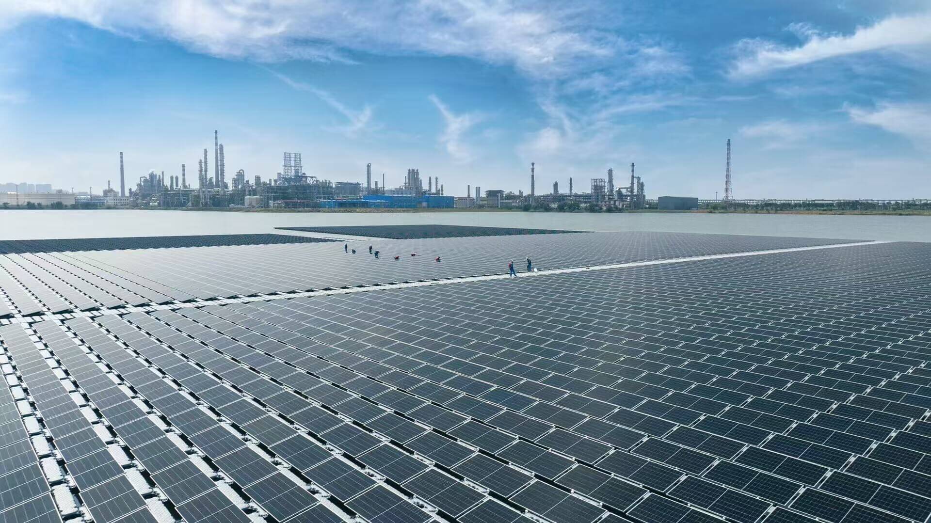 Solar panels floating on the water near coastline 