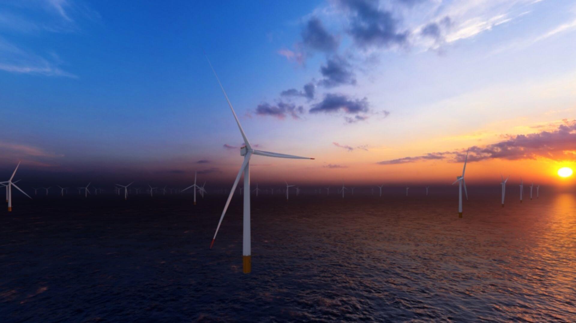 Rows of wind turbines in calm set with sun setting on the horizon
