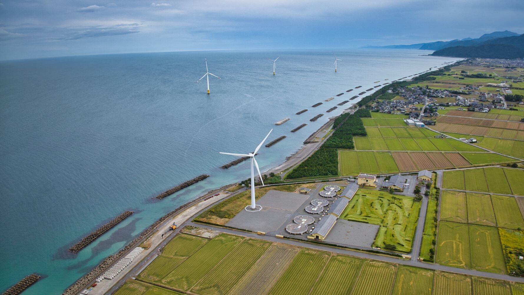 Aerial view of Onshore and offshore wind turbines in Toyama Bay, Japan