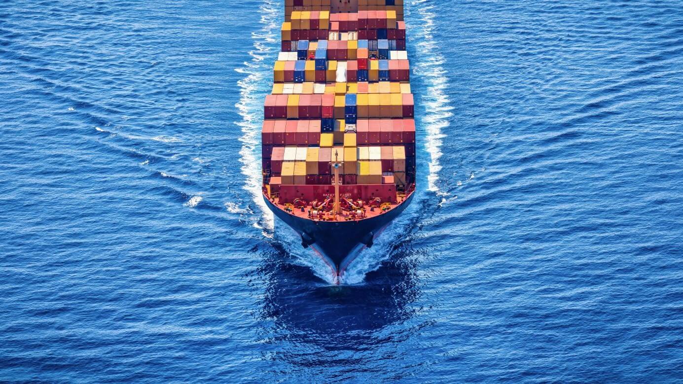 Aerial view of ship at sea, carrying containers
