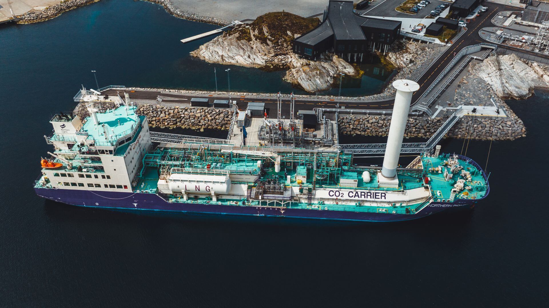 Aerial view of CO2 carrier offloading in dock 