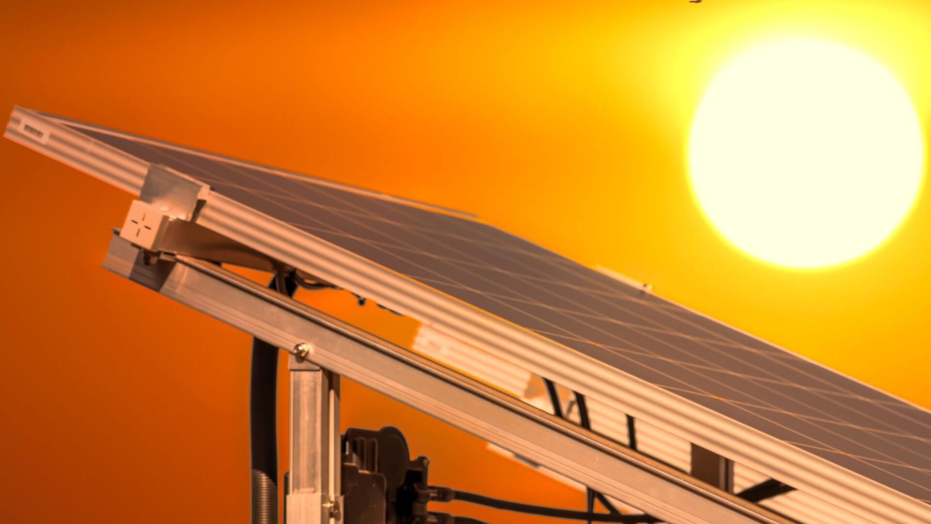 Close up of solar panel and the sun