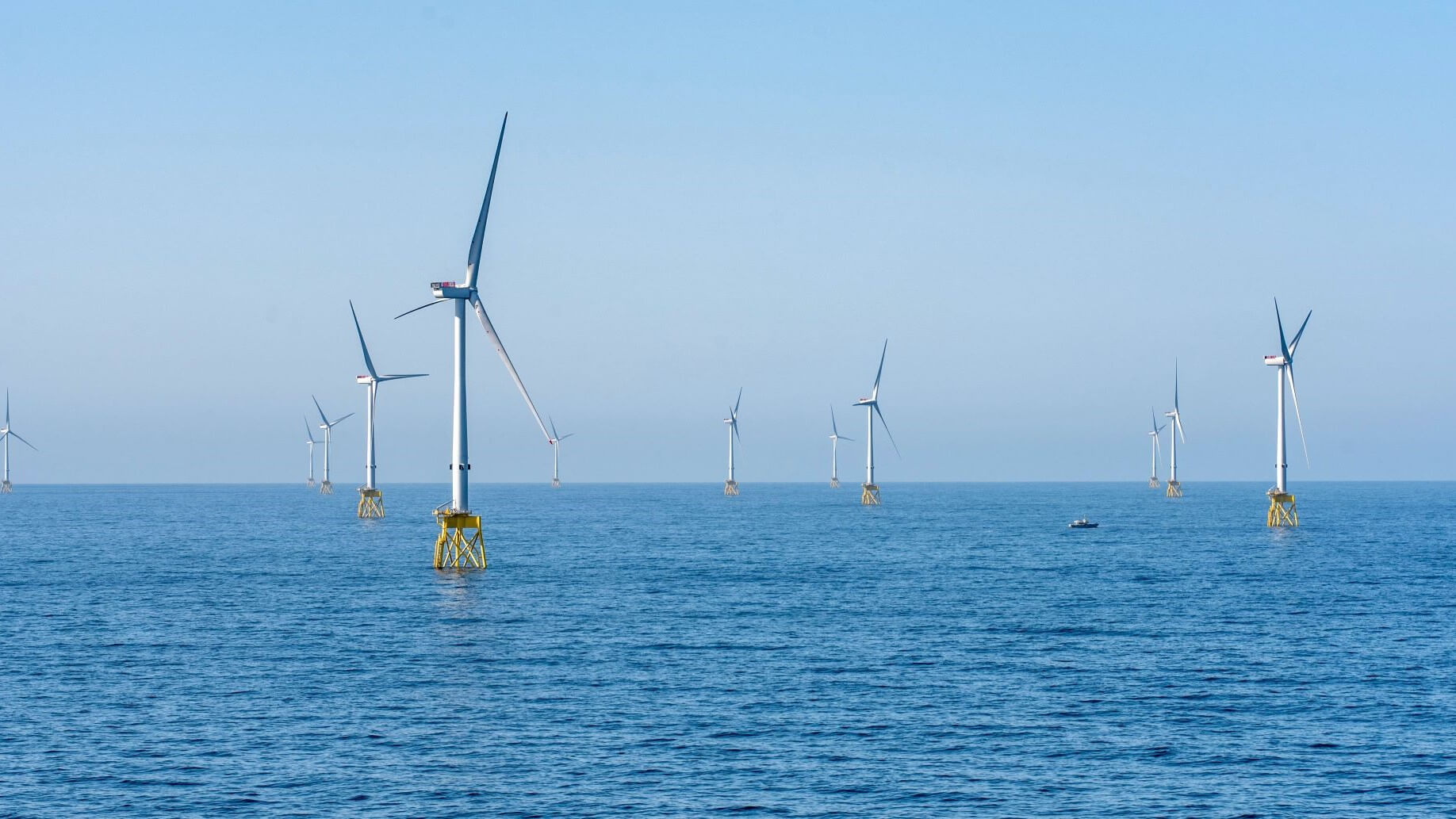 A group of wind turbines in the ocean