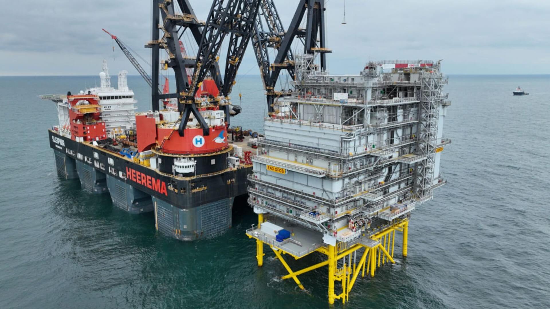 A large crane on a platform in the water