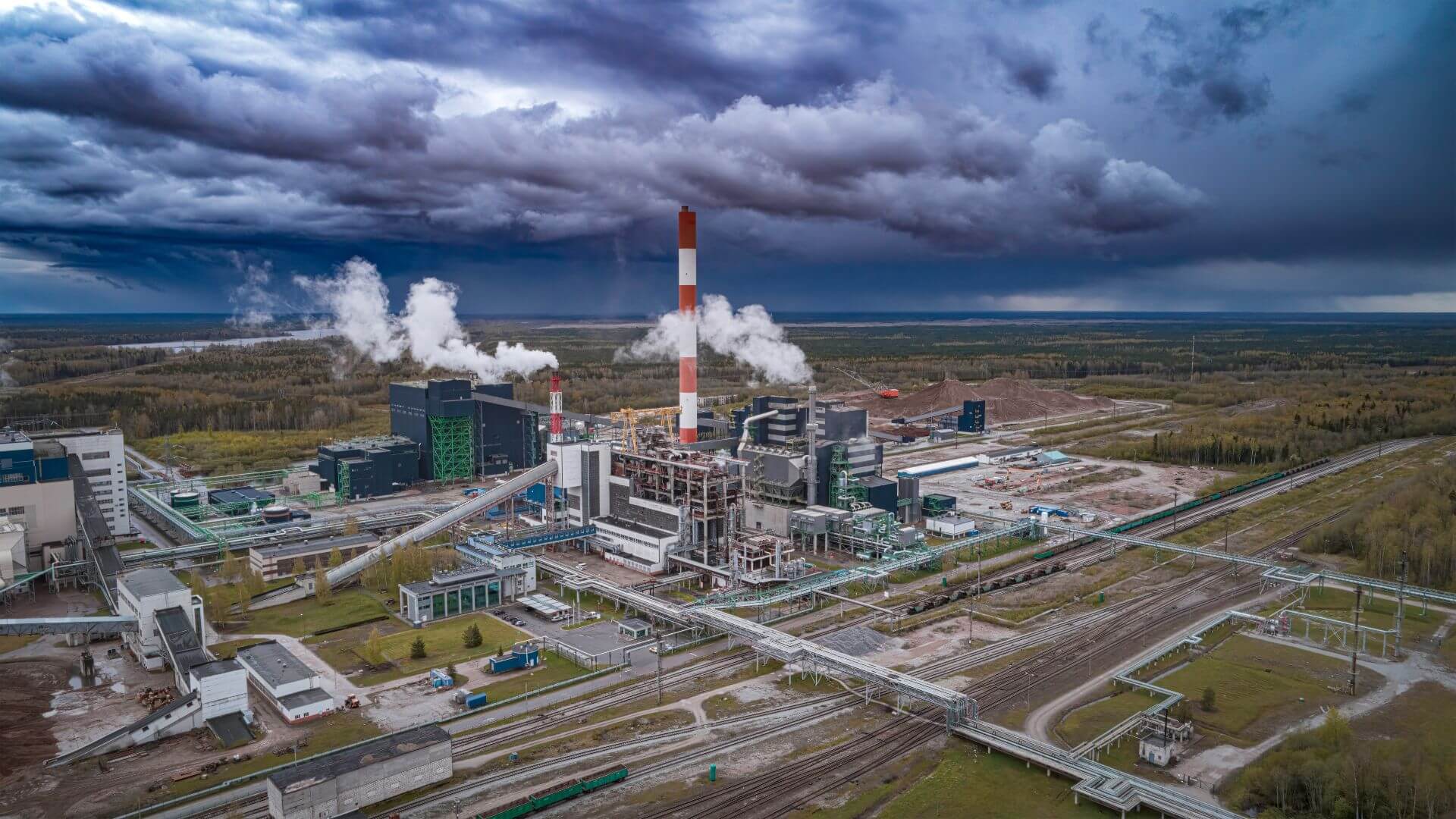 Aerial view of oil shale facility against dark sky