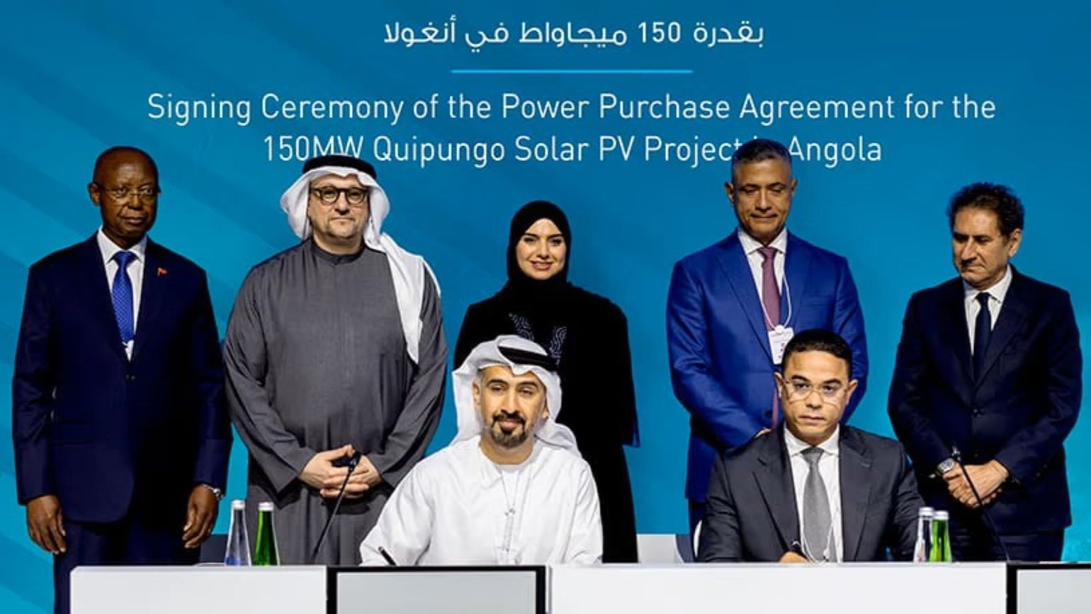 Group of seven officials at signing ceremony