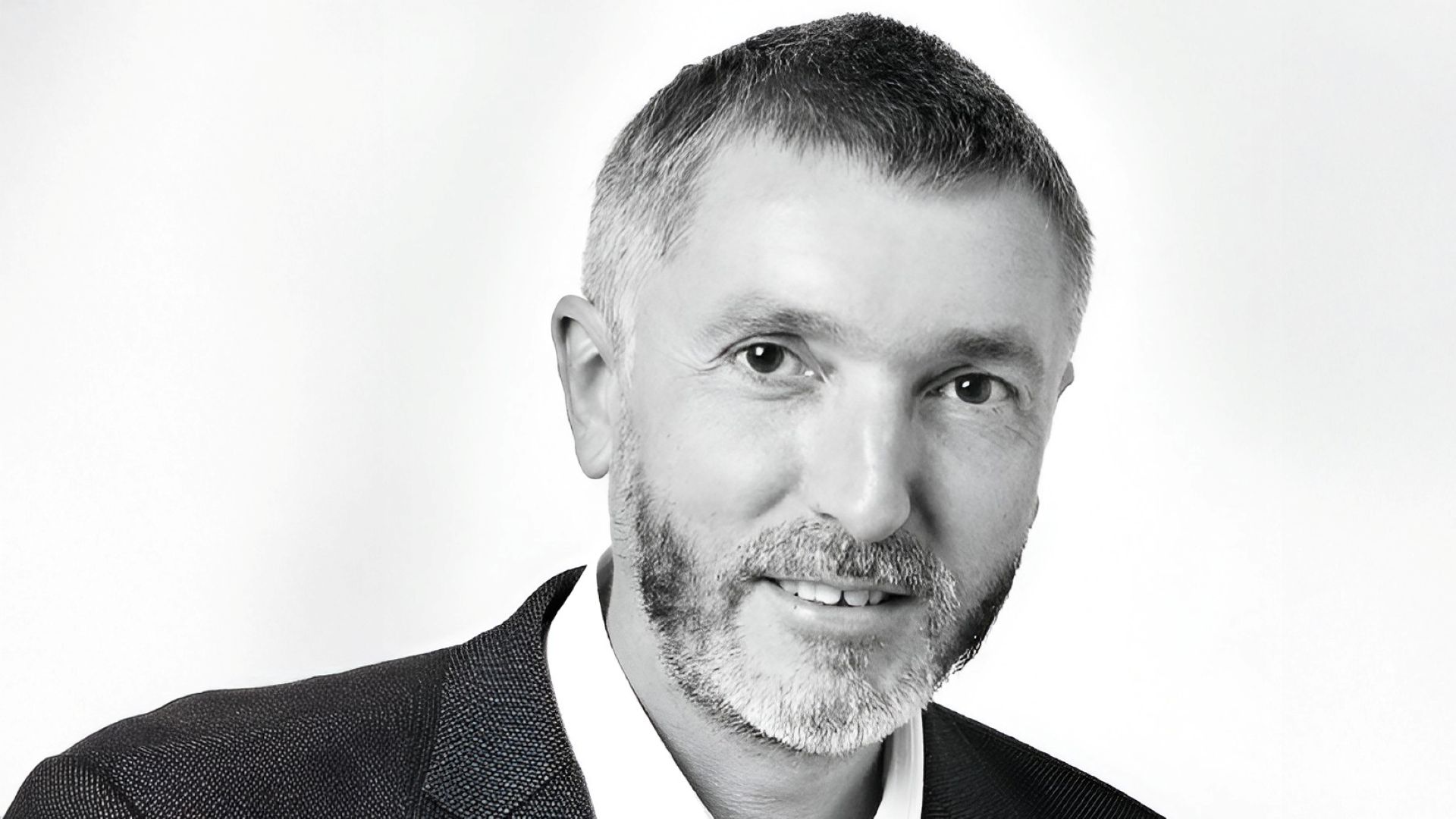 Black and white head and shoulders photo of Stephan Rupp
