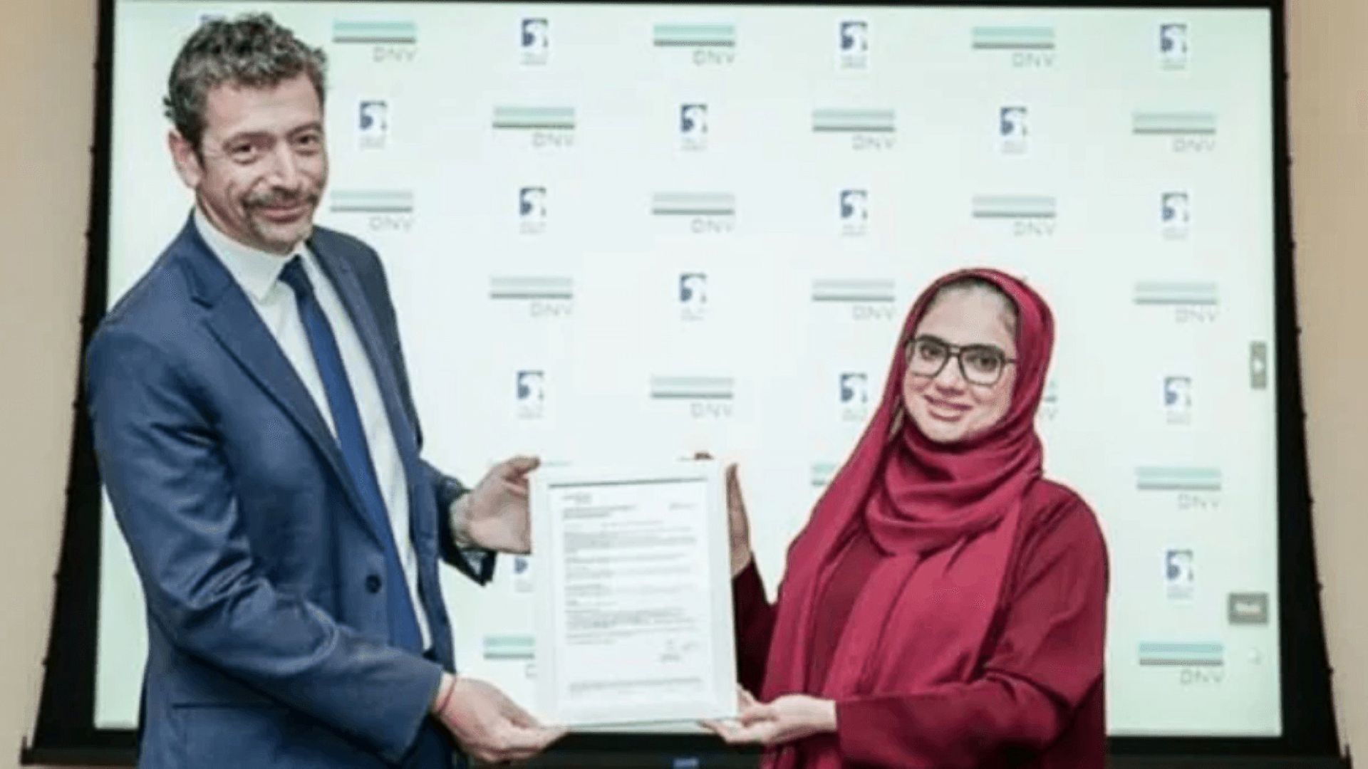 Brice Le Gallo presenting certificate to Ayesha Abdul Rahman Al Marzouqi