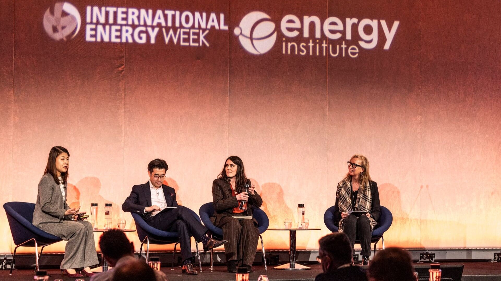 View from conference floor of four seated panellists under Energy Institute and International Energy Week logo