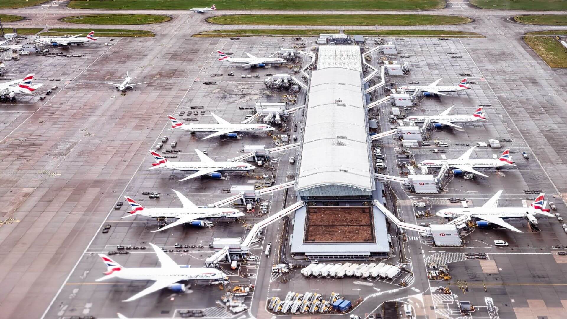 Aerial view of planes around Heathrow terminal building