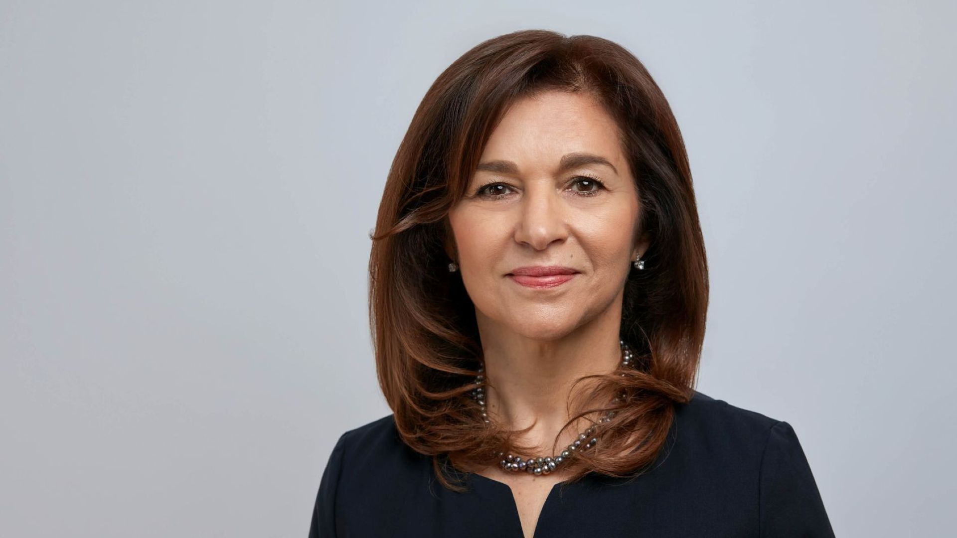 Head and shoulders photo of Maxine Ghavi set against grey backdrop