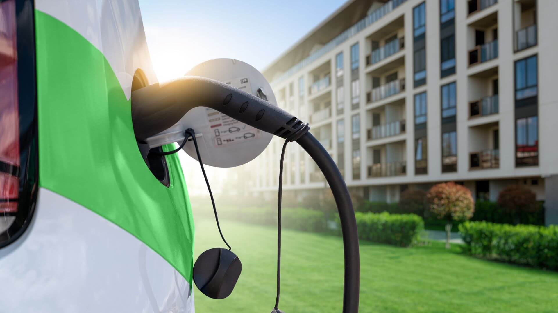 Close up of EV charging near modern building