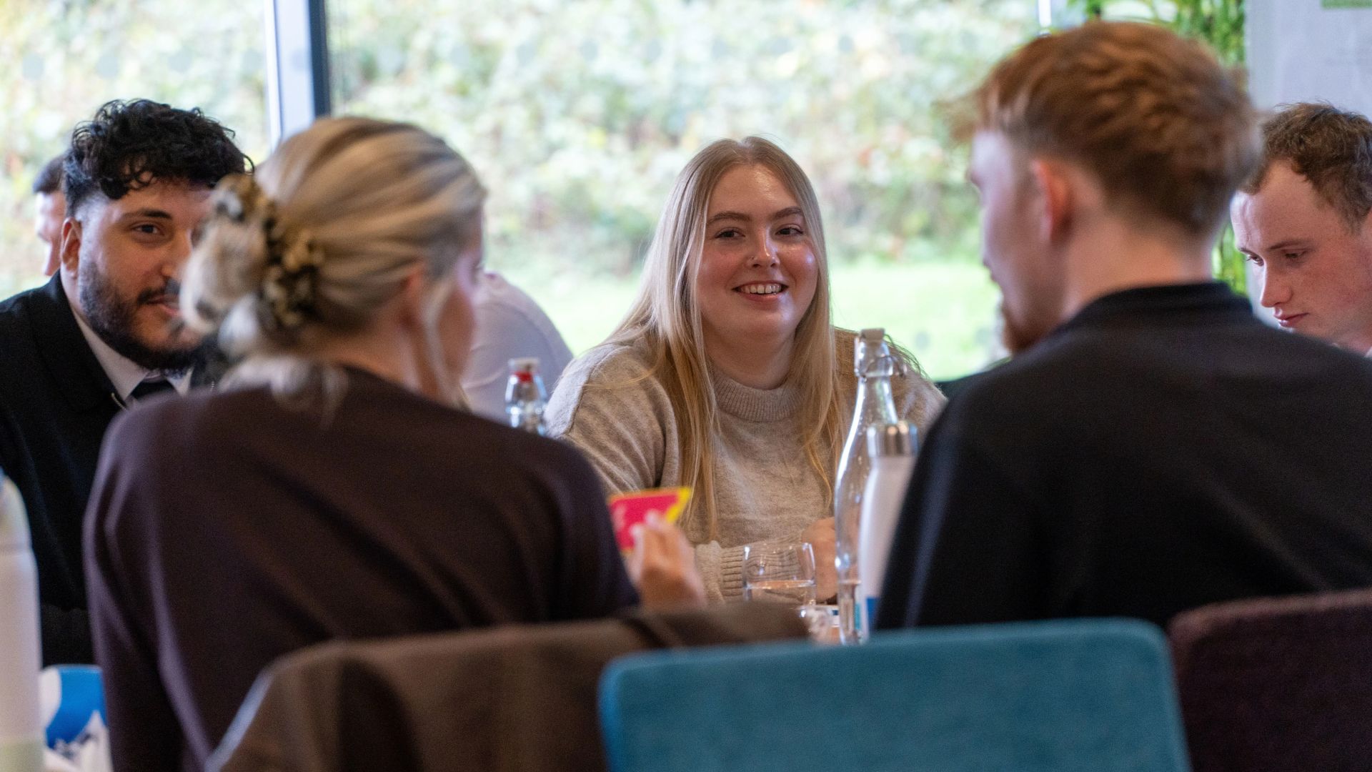 Group of apprentices around a table