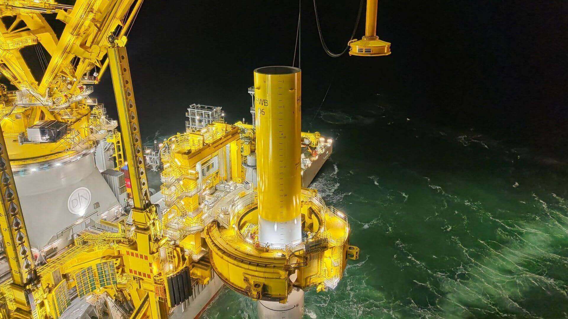 Crane and machinery at sea during monopile installation