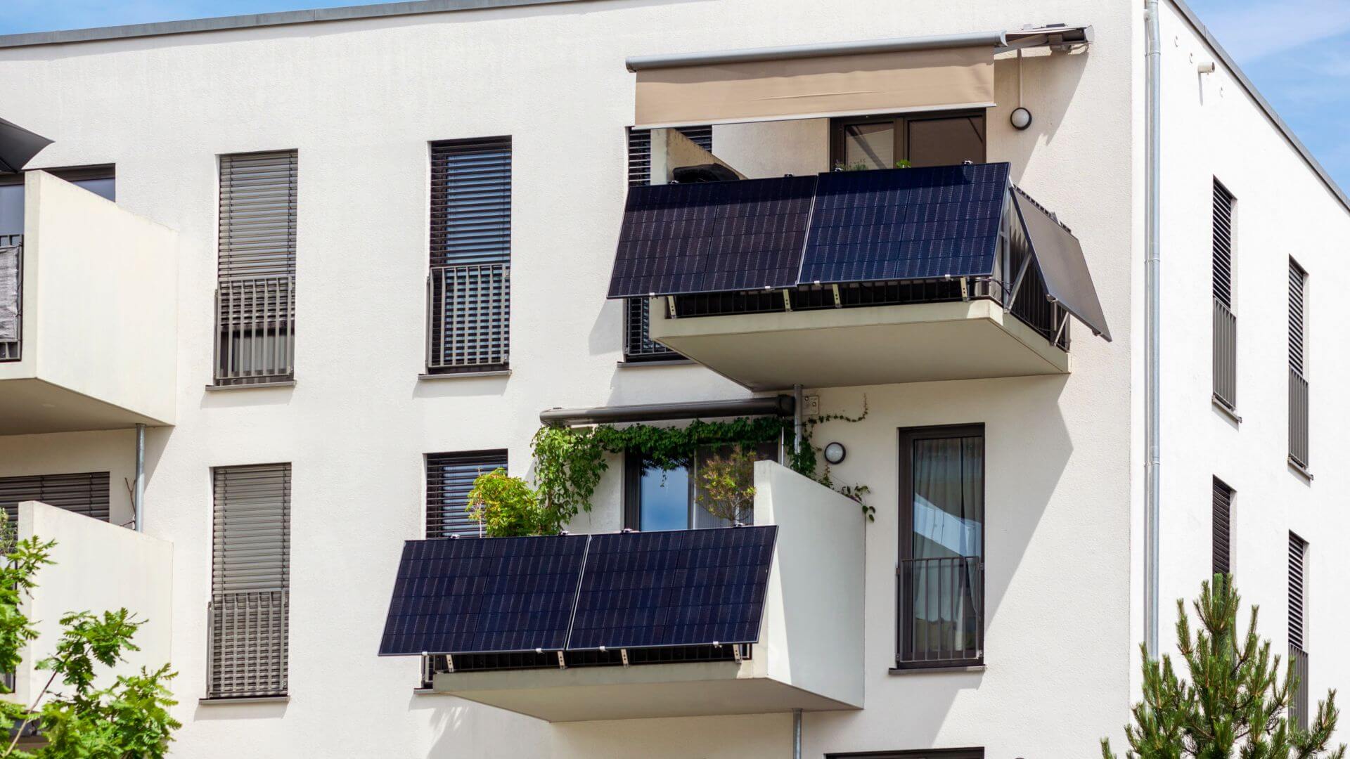 Exterior view of building with solar panels on balconies