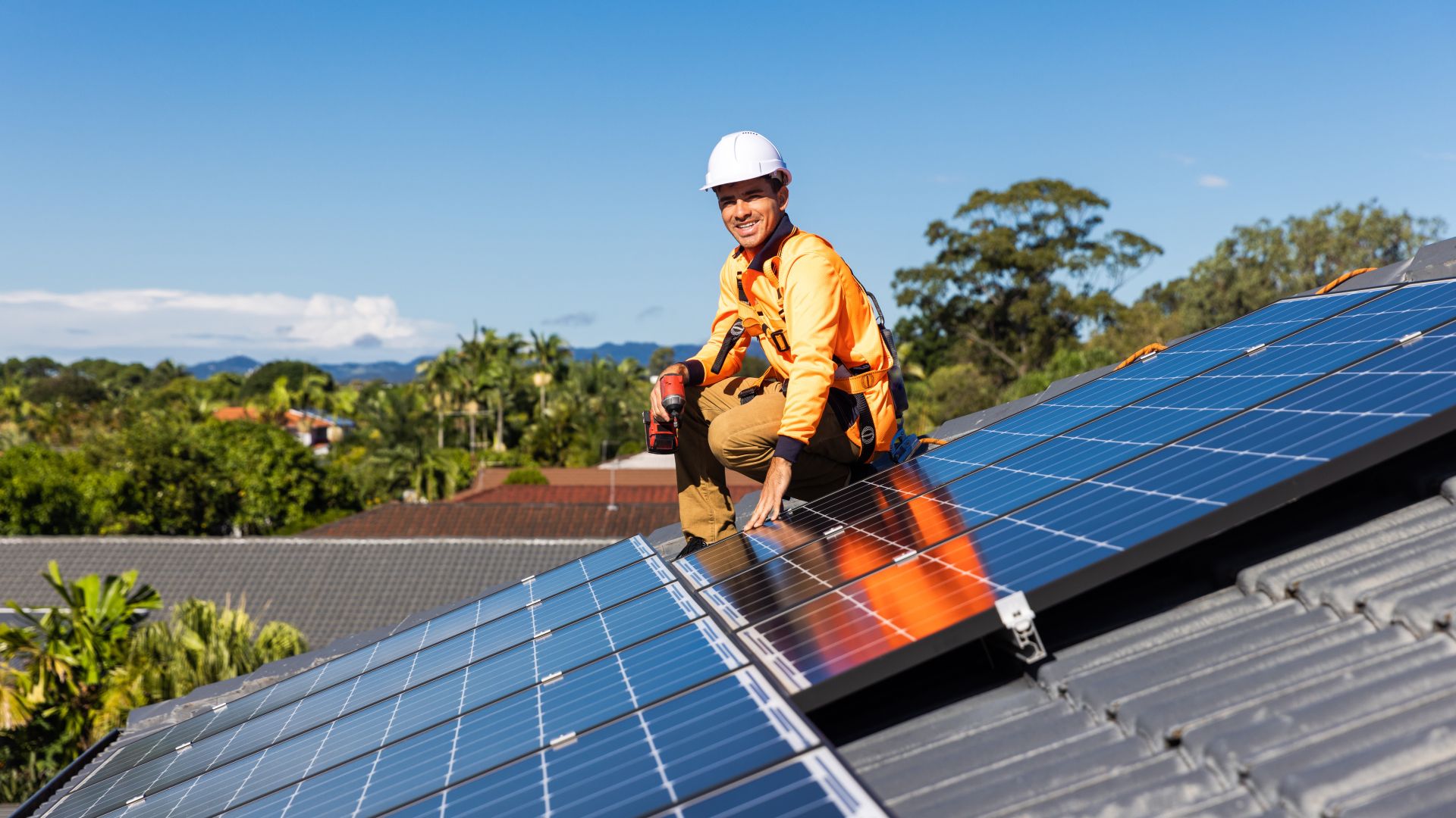 Engineer on roof with solar panels